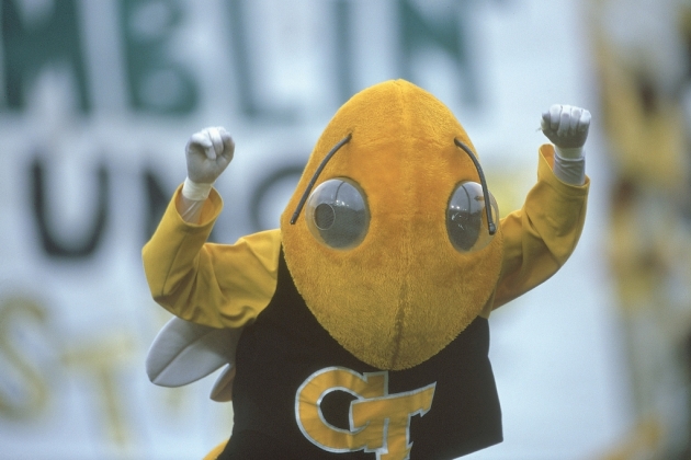 Buzz with arms raised signaling victory.